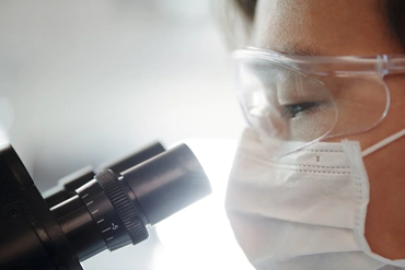 Doctor looking at a microscope